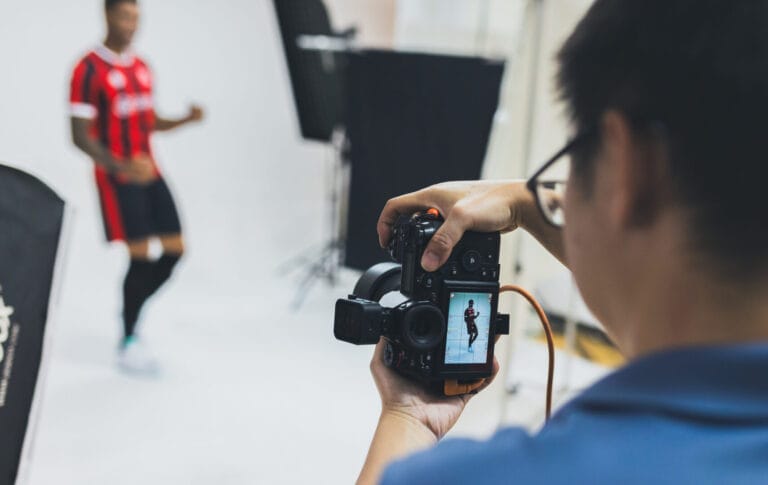 Male model posting in front of camera in studio
