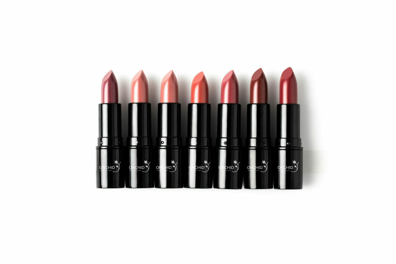 Lipstick mechanism featuring black cases and smooth twist-up design for cosmetic brands.