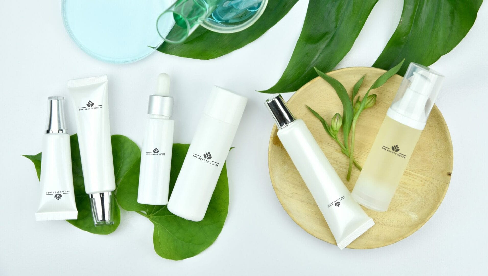 Clean white cosmetic bottles and dropper bottles