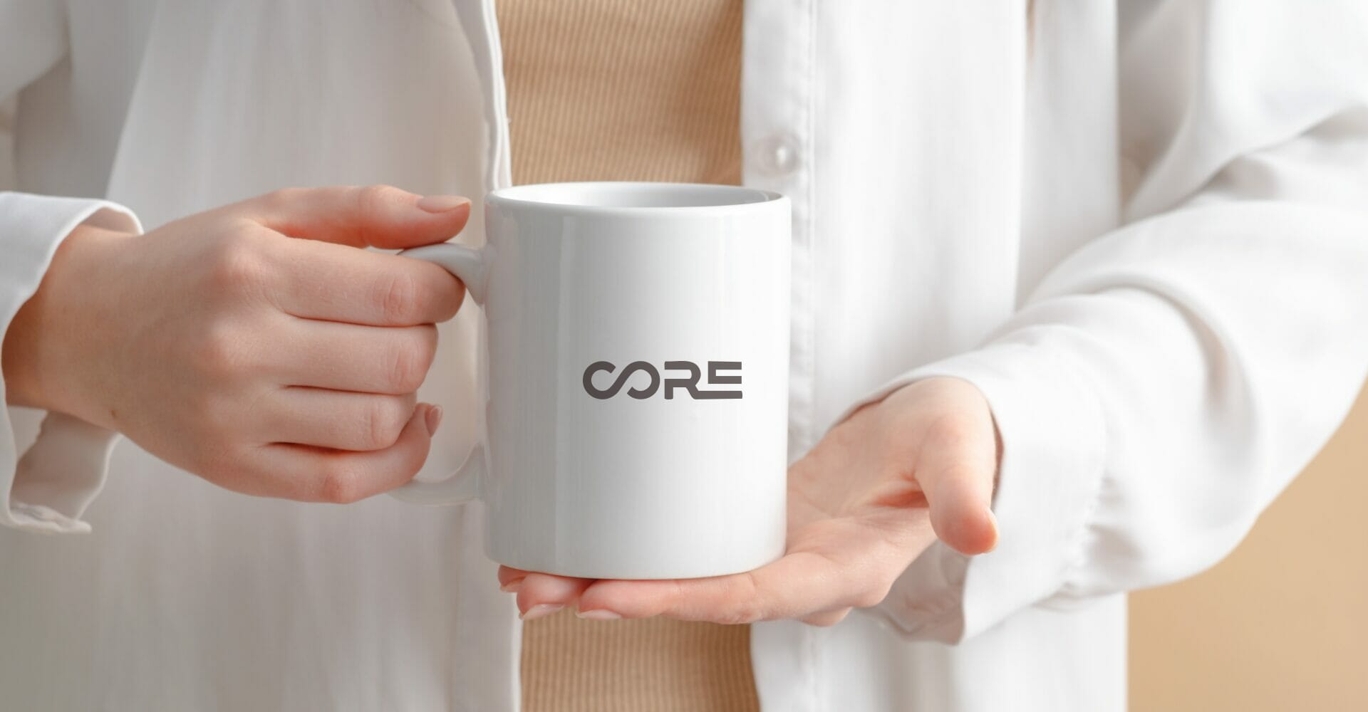 white ceramic mug with a sleek “CORE” logo, representing custom printed drinkware for branded promotional use.