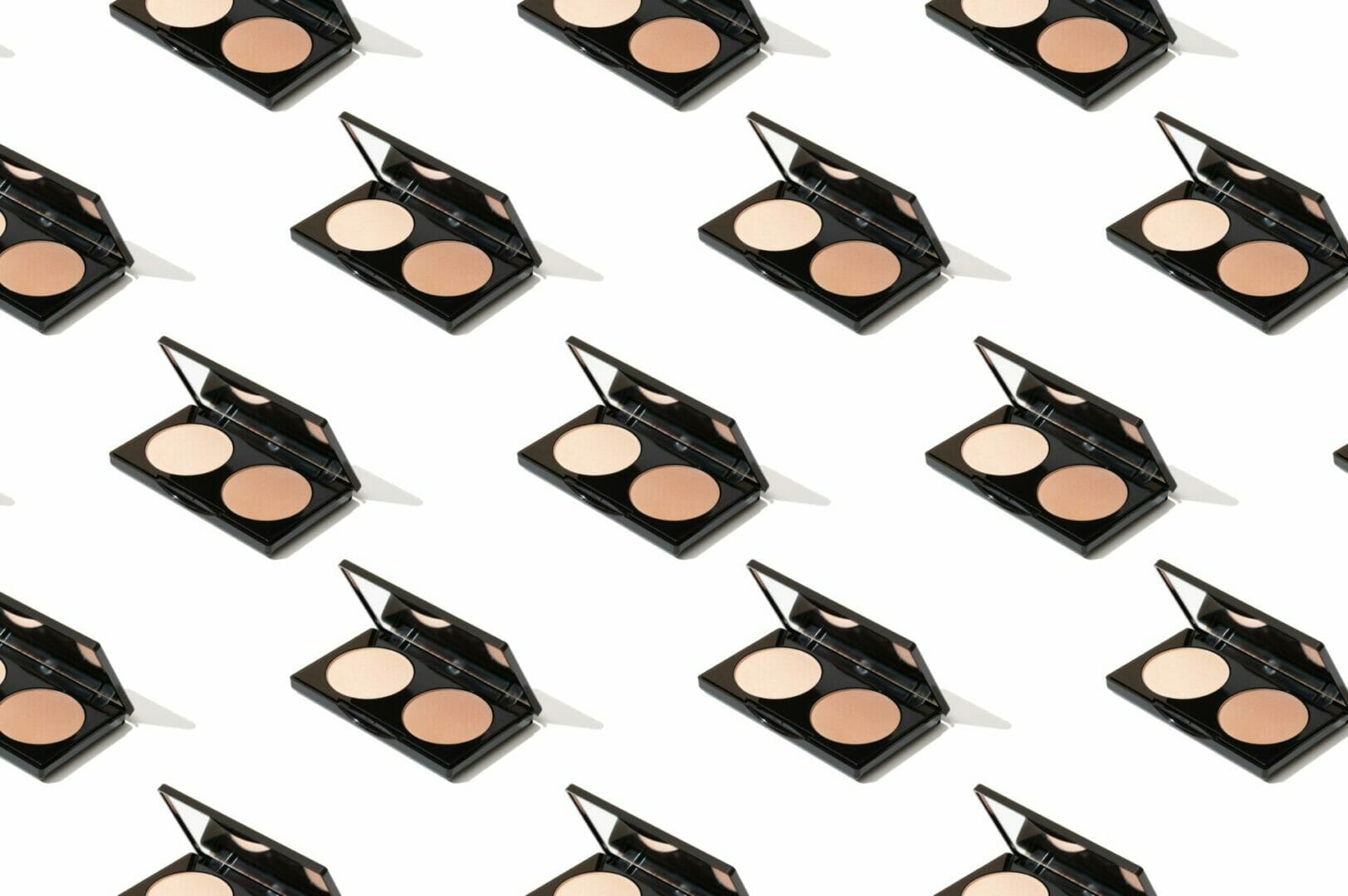Various black compact cases are shown arranged in an orderly grid pattern.
