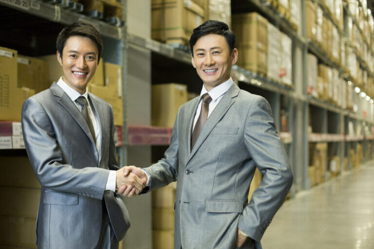 business partners shaking hands after finding a manufacturer in china