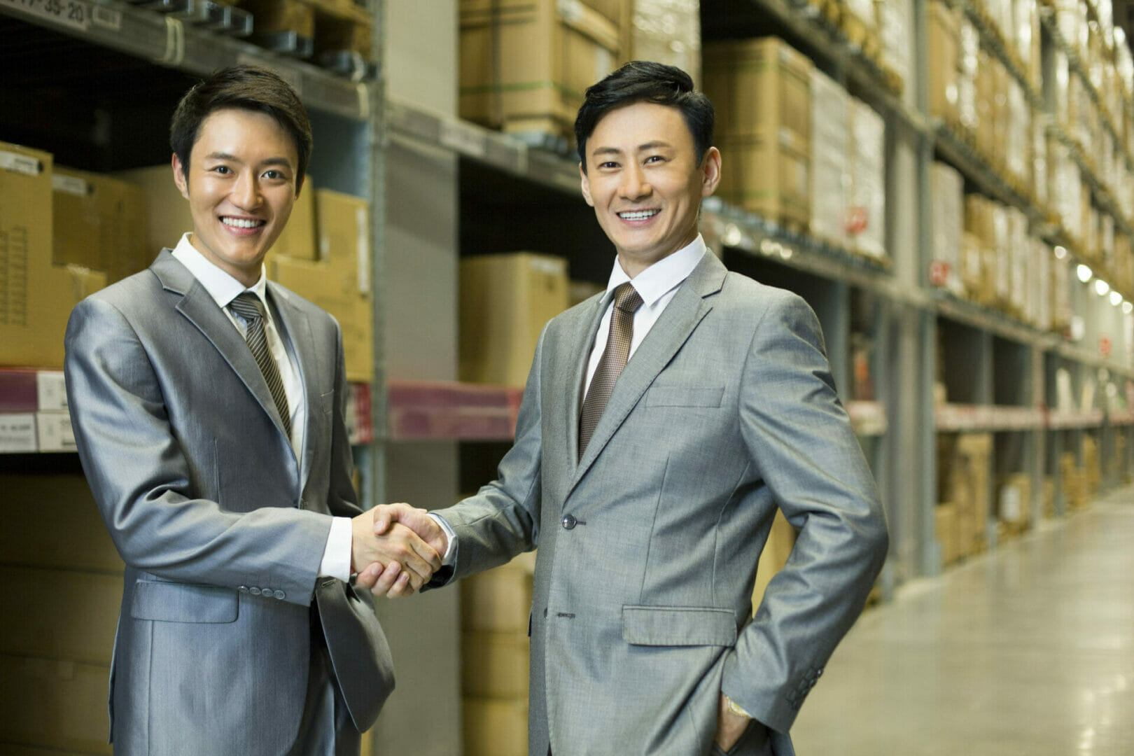 business partners shaking hands after finding a manufacturer in china